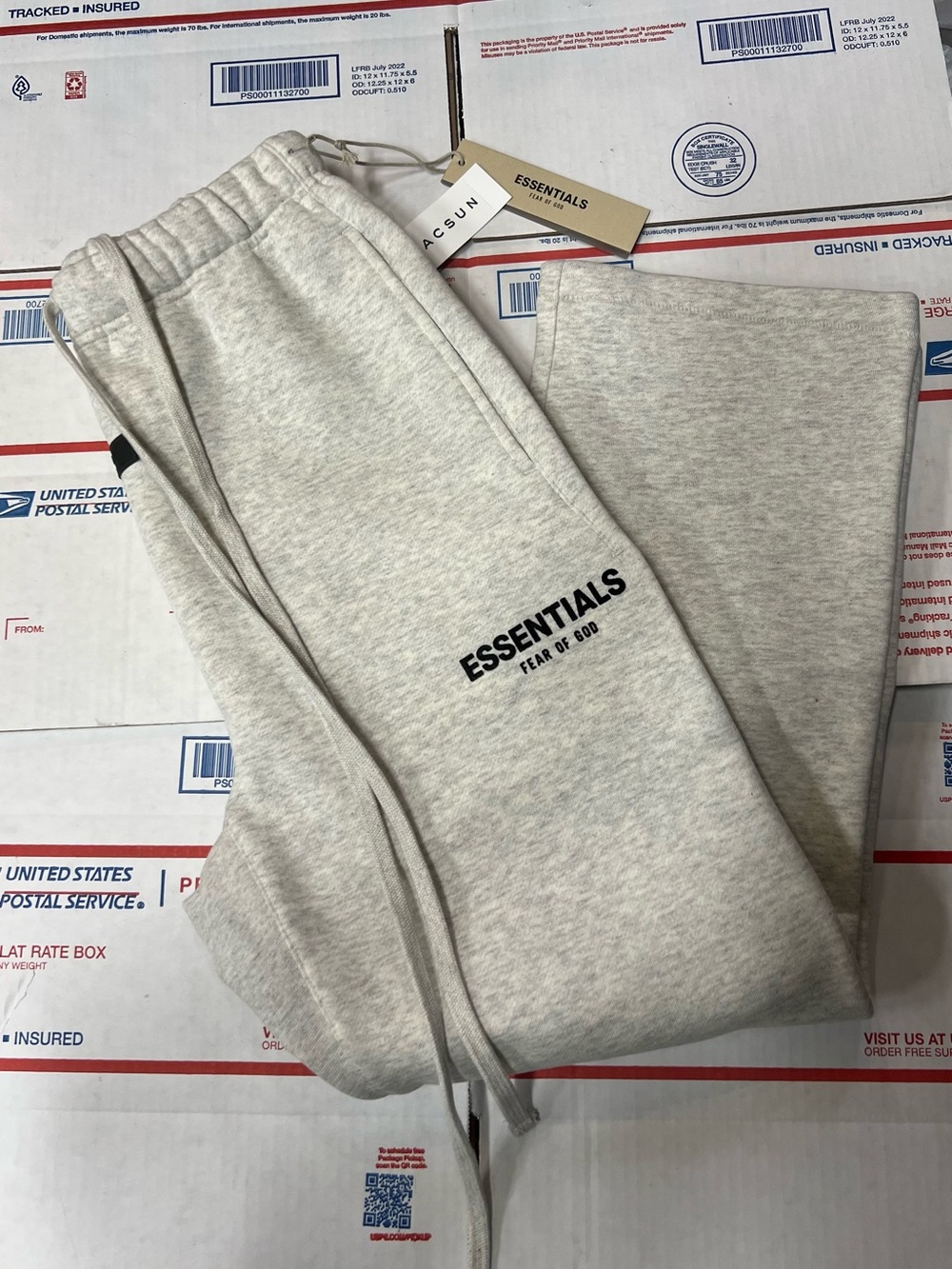 Fear of God Essentials Heather Light Gray Sweatpants with Black Logo